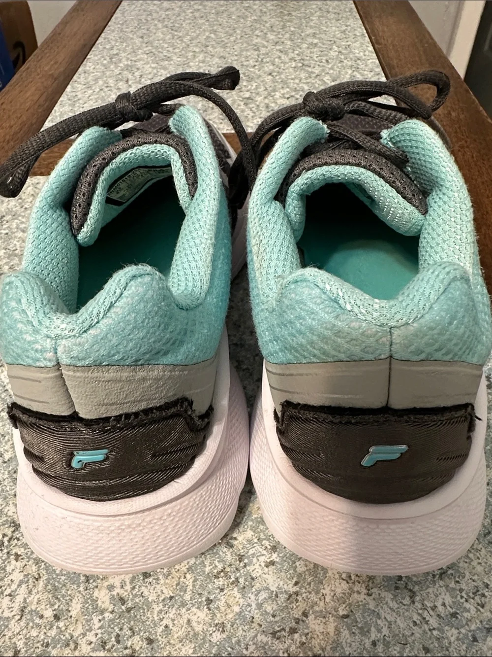 Fila women’s sneakers. Ultra lightweight. Size 6.5. Gray and teal. Breathable